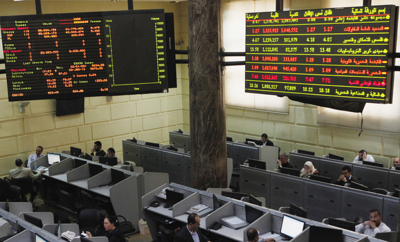Traders work at the Egyptian stock exchange in Cairo